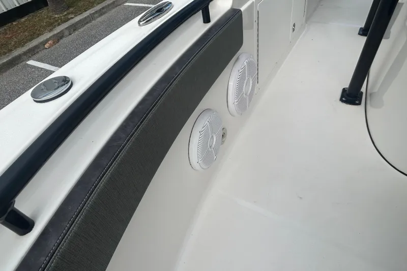 Slide: The Image of 2022 Crevalle 26 HBW boat interior with speakers and seating detail. - 23
