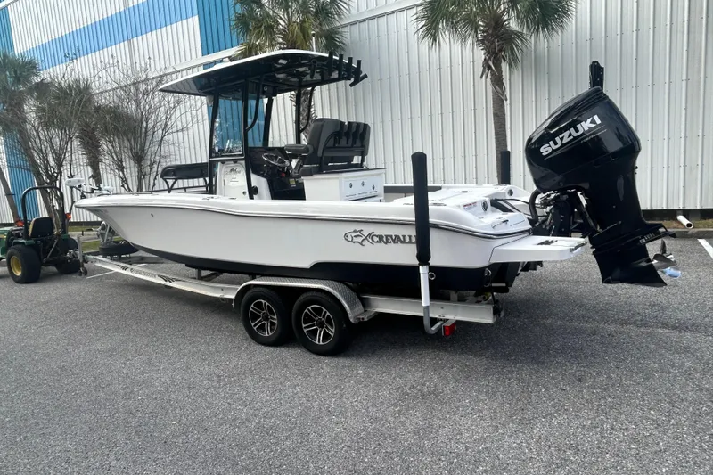 Slide: The Image of 2022 Crevalle 26 HBW boat on trailer with Suzuki outboard motor. - 4