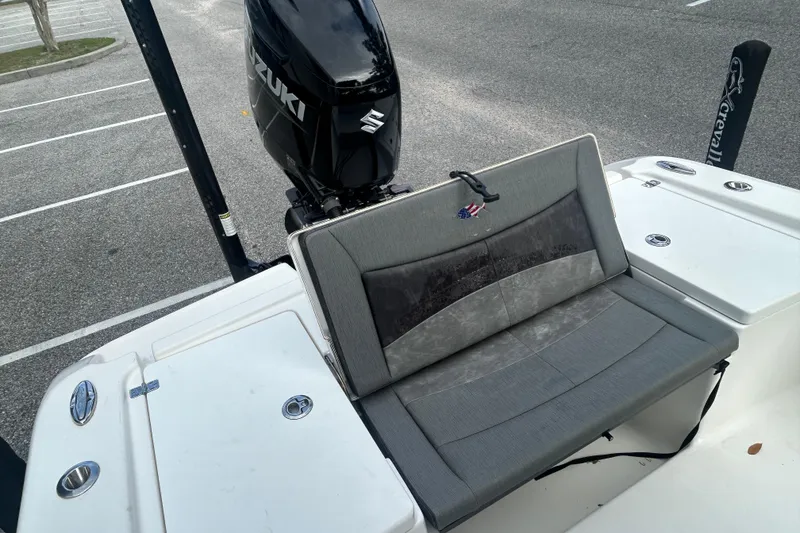 Slide: The Image of 2022 Crevalle 26 HBW boat with Suzuki outboard motor and gray seating. - 9