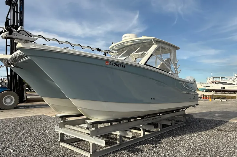 Slide: The Image of 2023 World Cat 280 DC-X boat on display, showcasing sleek design and modern features. - 12