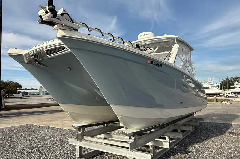 Slide: The Image of 2023 World Cat 280 DC-X boat on display, featuring sleek design and modern technology. - 13