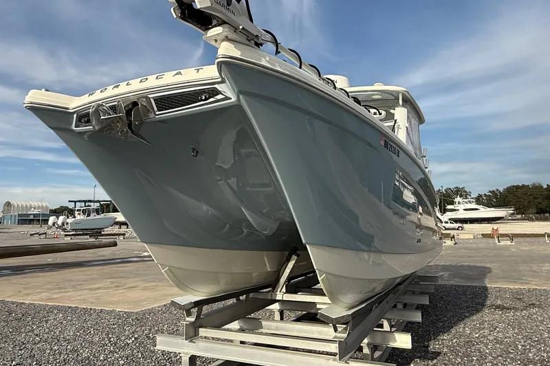 Slide: The Image of 2023 World Cat 280 DC-X boat on a trailer, displayed outdoors. - 14