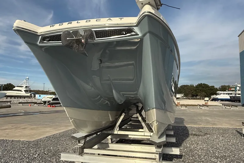 Slide: The Image of 2023 World Cat 280 DC-X boat on display in a marina setting. - 15
