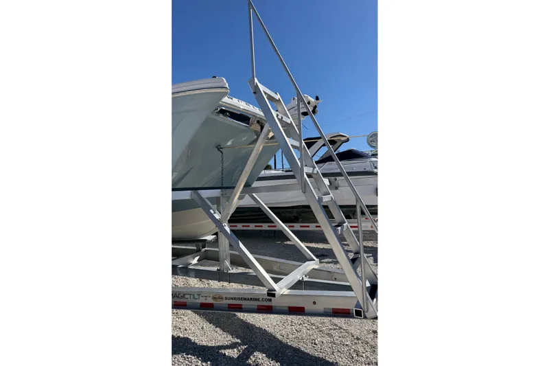 Slide: The Image of 2023 World Cat 280 DC-X boat on trailer with metal access stairs. - 28