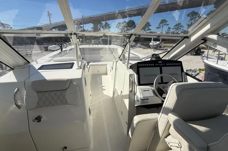 Slide: The Image of 2023 World Cat 280 DC-X boat interior with Garmin navigation system and luxurious seating. - 36