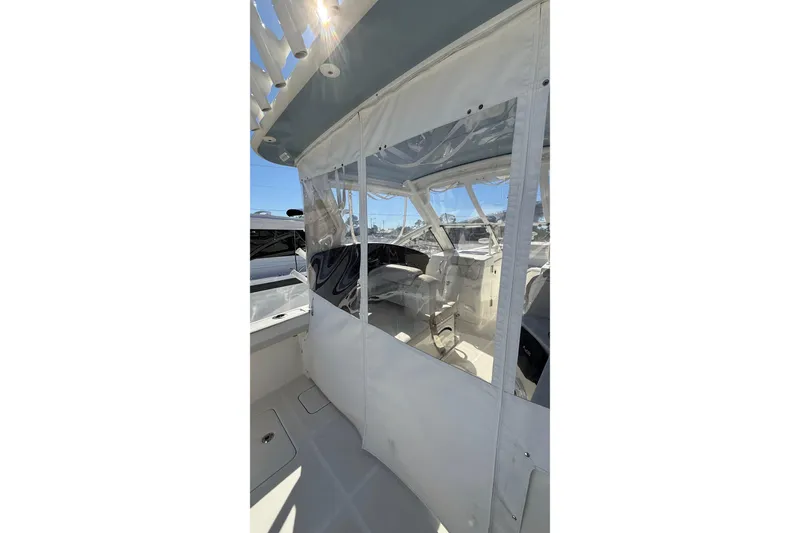 Slide: The Image of 2023 World Cat 280 DC-X boat interior with clear enclosure and seating. - 39
