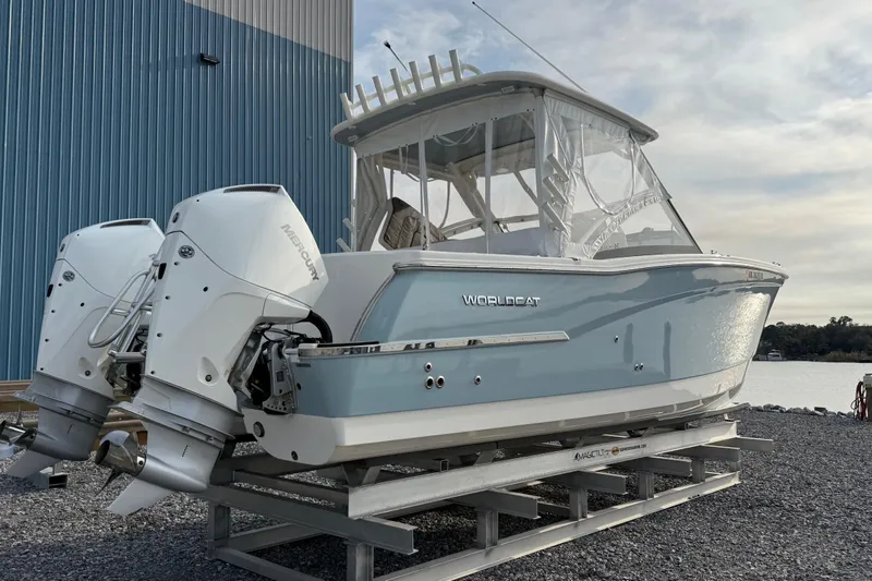 Slide: The Image of 2023 World Cat 280 DC-X boat with dual Mercury engines on display. - 4