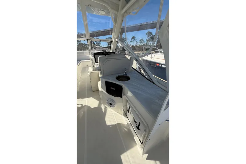 Slide: The Image of 2023 World Cat 280 DC-X boat interior with seating and storage compartments. - 41