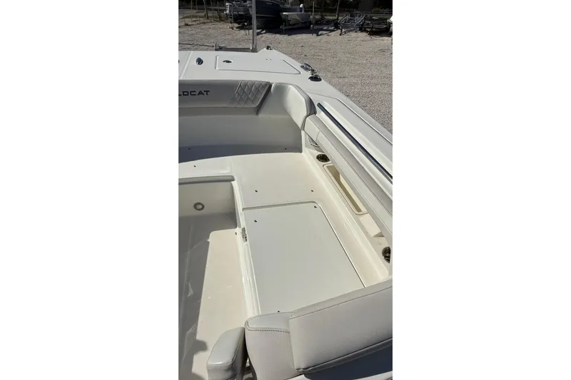 Slide: The Image of 2023 World Cat 280 DC-X boat interior with cushioned seating and storage compartments. - 46
