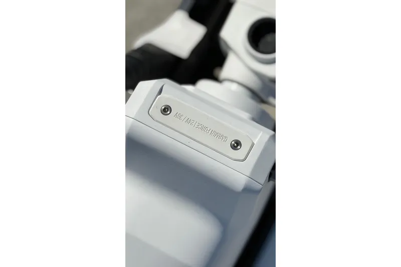 Slide: The Image of Close-up of 2023 World Cat 280 DC-X boat component with engraved text. - 50