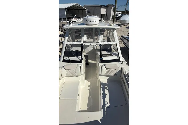 Slide: The Image of 2023 World Cat 280 DC-X boat with Garmin equipment, featuring spacious seating and modern design. - 54