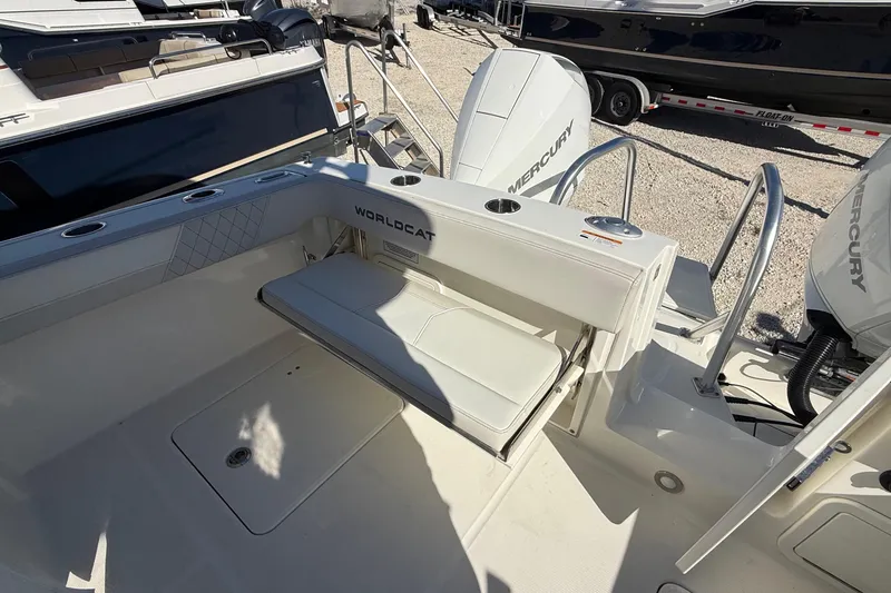 Slide: The Image of 2023 World Cat 280 DC-X boat interior with seating and Mercury engines. - 64