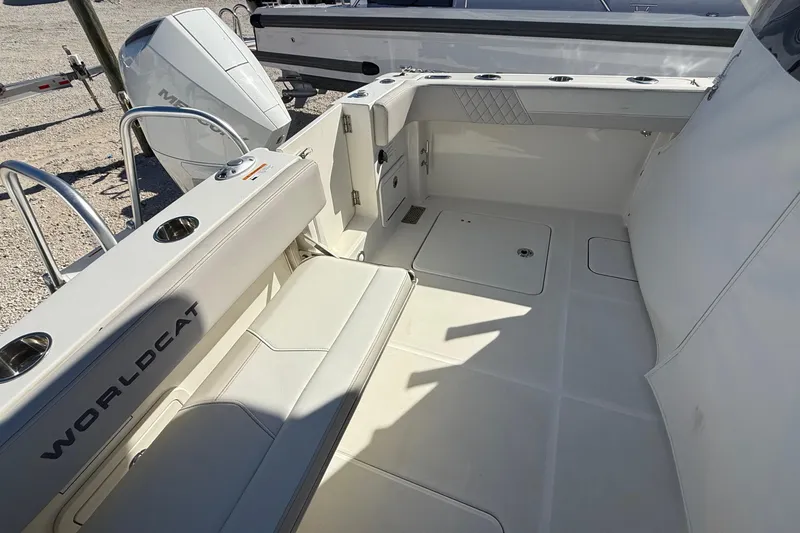 Slide: The Image of 2023 World Cat 280 DC-X boat interior with seating and storage compartments. - 65