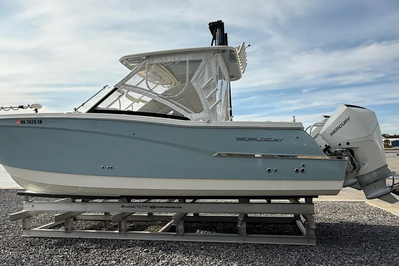 Slide: The Image of 2023 World Cat 280 DC-X boat with Mercury outboard engine on a trailer. - 9