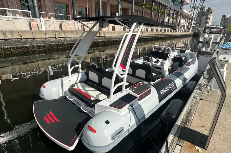 Slide: The Image of 2026 Highfield 660 Velox boat docked, featuring sleek design and modern amenities. - 1