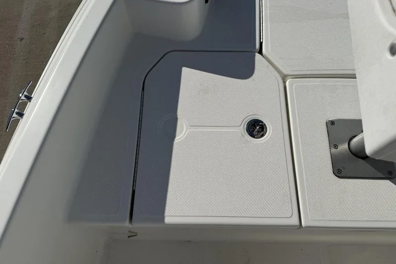 Slide: The Image of 2019 Bayliner Element E18 boat deck with storage compartment and cleat. - 10