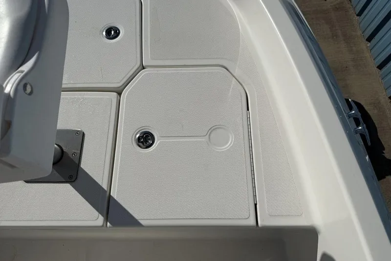 Slide: The Image of 2019 Bayliner Element E18 boat deck with storage compartments and seating area. - 12