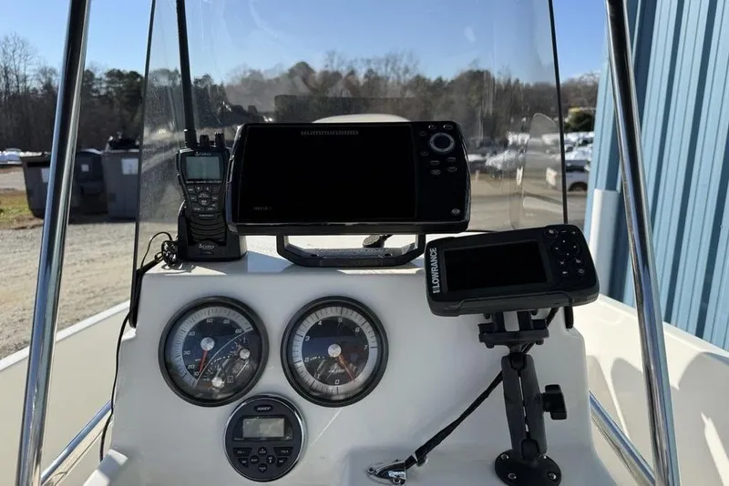 Slide: The Image of 2019 Bayliner Element E18 dashboard with navigation and communication equipment. - 14