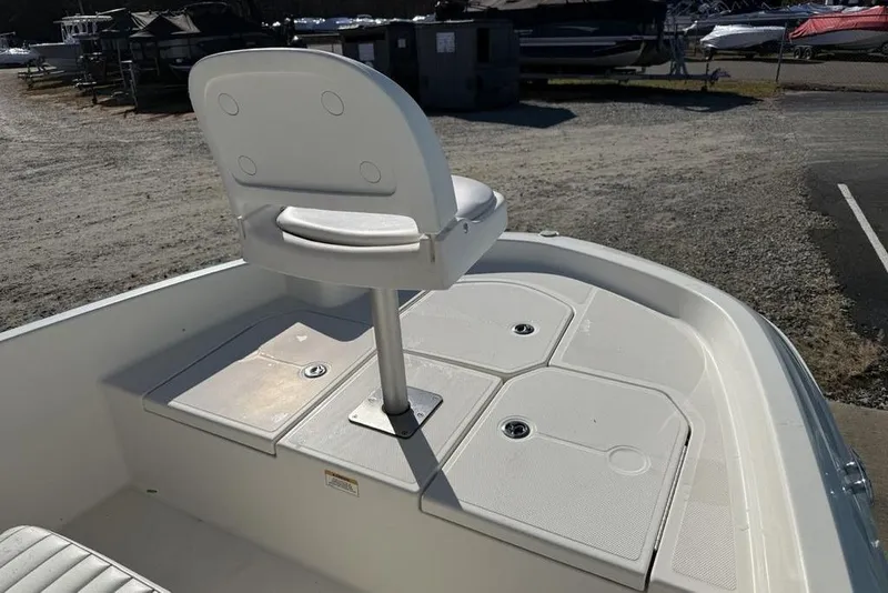 Slide: The Image of 2019 Bayliner Element E18 boat with elevated seat and storage compartments. - 2