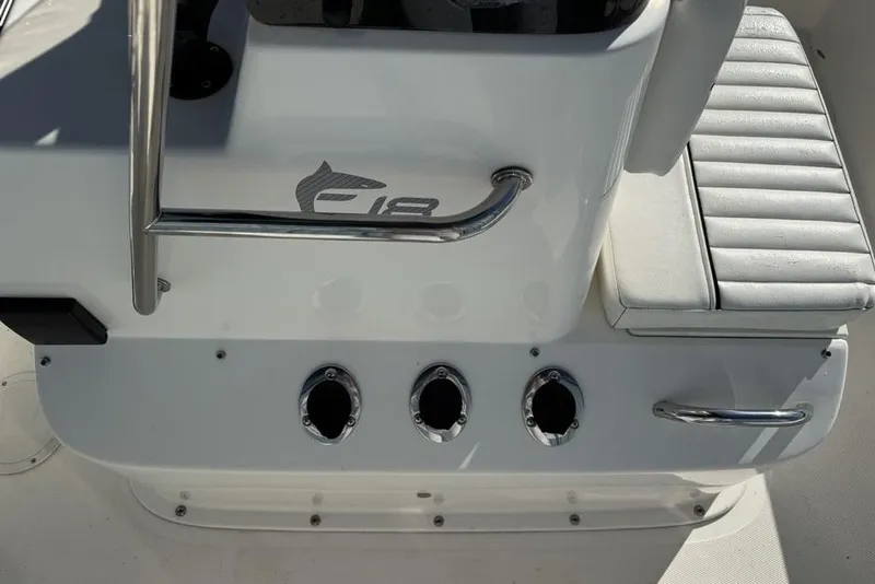 Slide: The Image of 2019 Bayliner Element E18 boat console with seating and chrome details. - 20