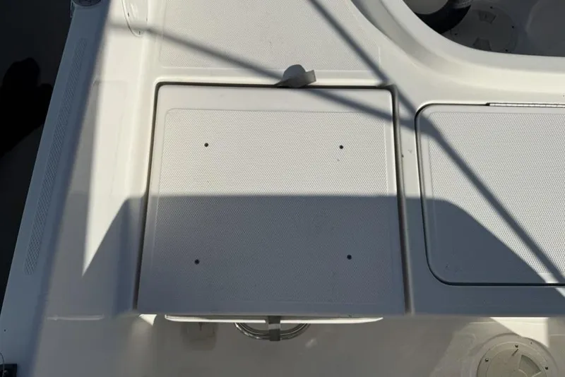 Slide: The Image of 2019 Bayliner Element E18 boat deck with storage compartments. - 28