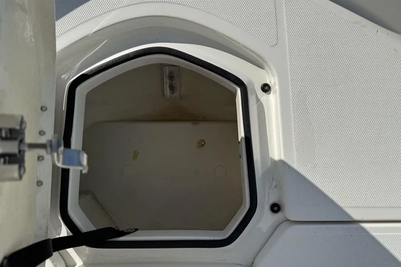 Slide: The Image of Open storage compartment on 2019 Bayliner Element E18 boat. - 3