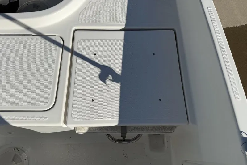 Slide: The Image of 2019 Bayliner Element E18 boat deck with storage compartments and shadow. - 30