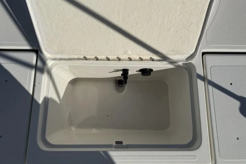 Slide: The Image of Open storage compartment on 2019 Bayliner Element E18 boat. - 31