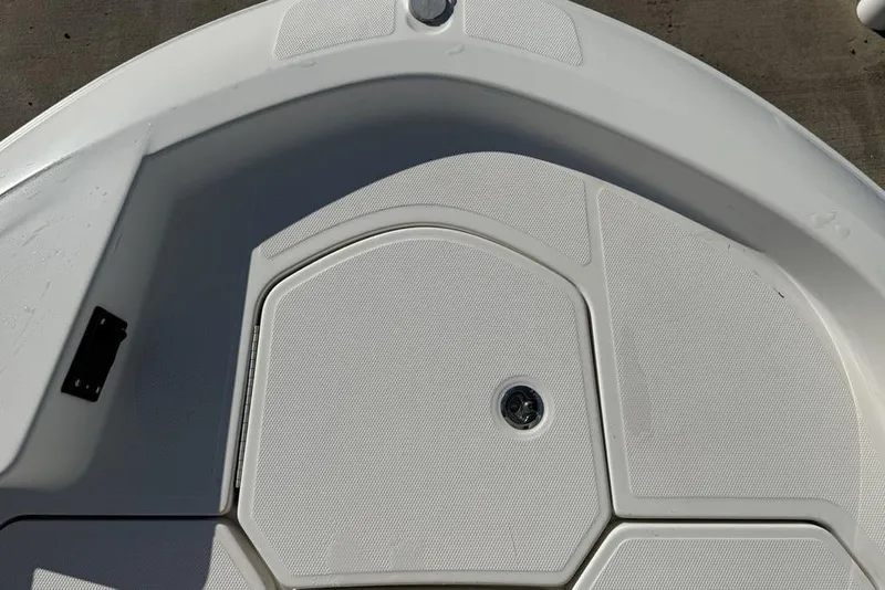 Slide: The Image of 2019 Bayliner Element E18 boat deck with storage compartment. - 6