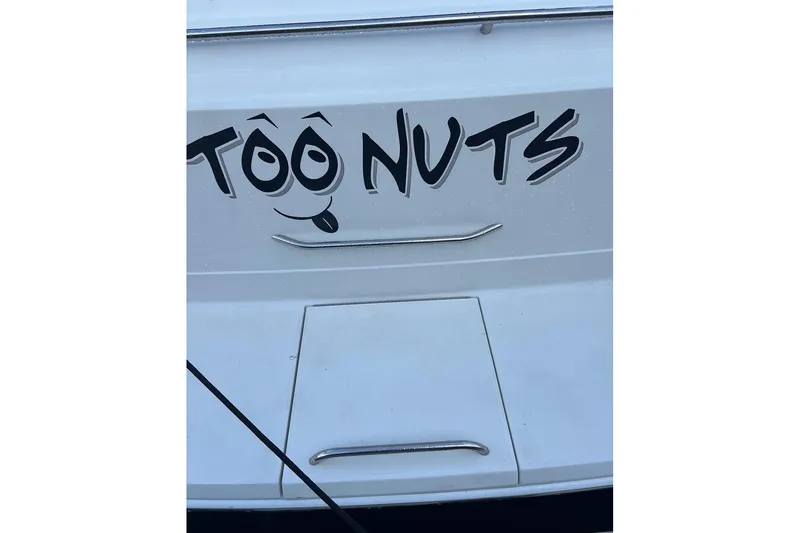 Slide: The Image of 2000 Formula 31 Performance Cruiser with "Too Nuts" graphic on the stern. - 11