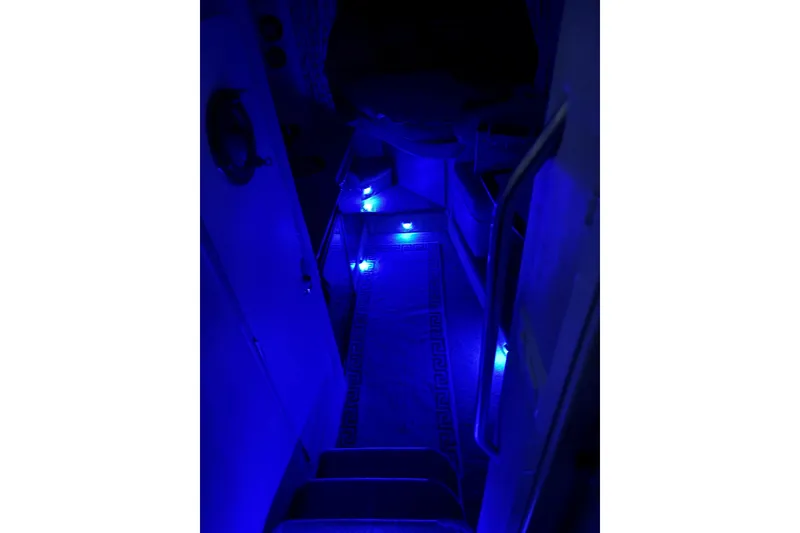 Slide: The Image of Dimly lit interior of a 2000 Formula 31 Performance Cruiser with blue LED lights. - 2