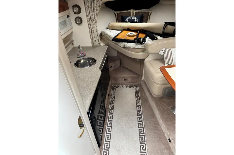 Slide: The Image of Interior of 2000 Formula 31 Performance Cruiser with kitchenette and seating area. - 7