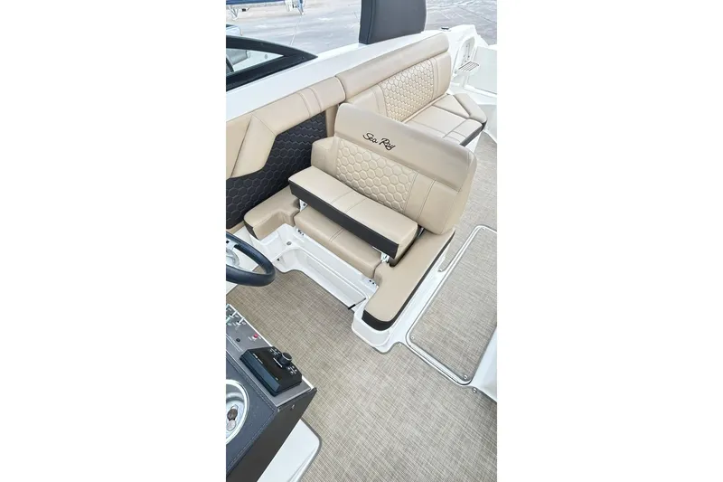 Slide: The Image of Luxurious interior of 2018 Sea Ray SDX 270 boat with beige seating and elegant design. - 13