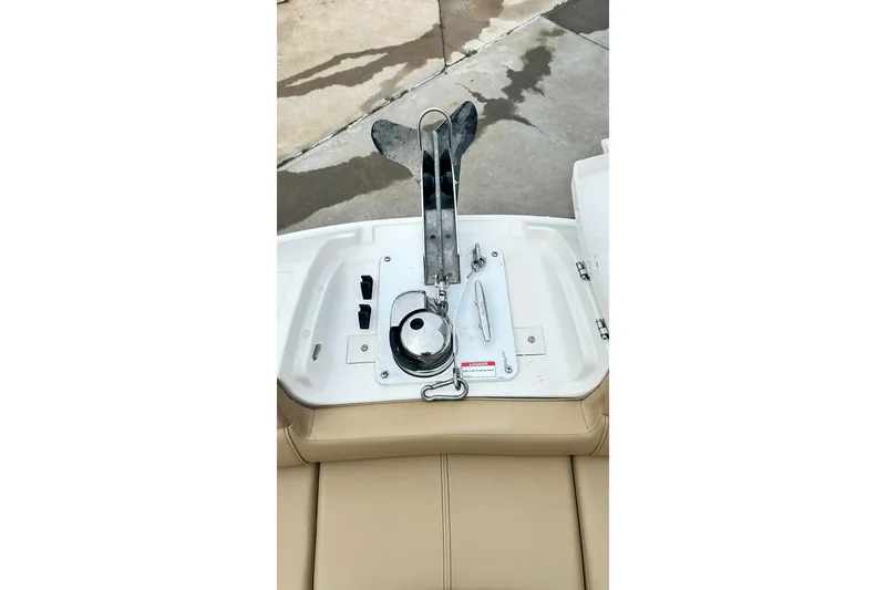 Slide: The Image of 2018 Sea Ray SDX 270 boat anchor compartment with beige seating. - 17