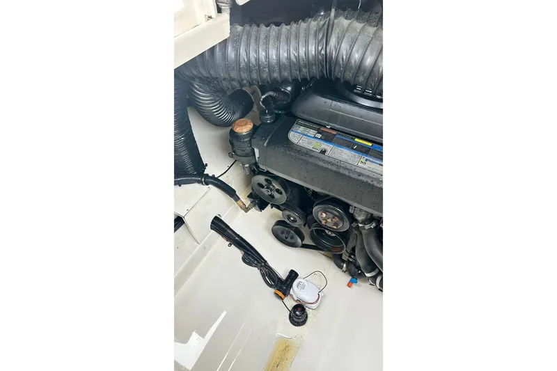 Slide: The Image of Engine compartment of a 2018 Sea Ray SDX 270 boat, showing mechanical components. - 24
