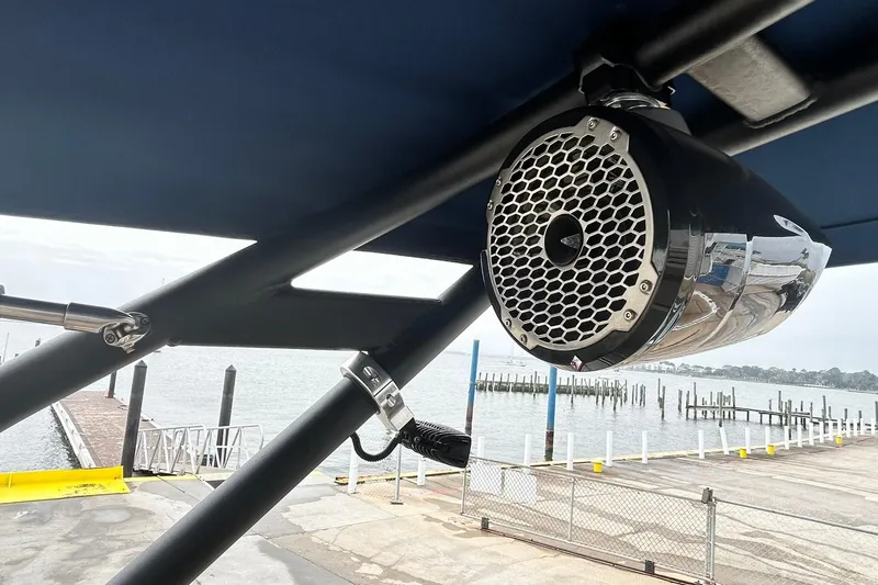 Slide: The Image of Speaker mounted on a 2018 Sea Ray SDX 270 boat, overlooking a marina. - 29