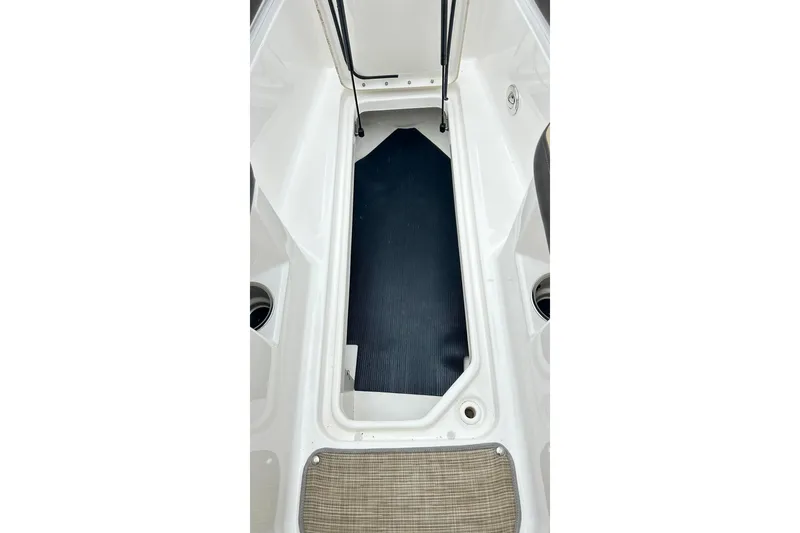 Slide: The Image of 2018 Sea Ray SDX 270 boat storage compartment with open hatch. - 32