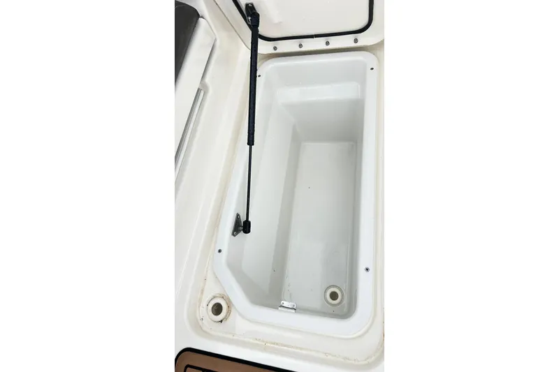 Slide: The Image of Open storage compartment on 2018 Sea Ray SDX 270 boat. - 34