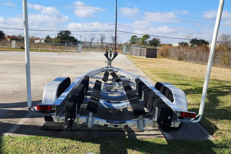 Slide: The Image of Empty boat trailer for 2018 Sea Ray SDX 270 on paved lot. - 46