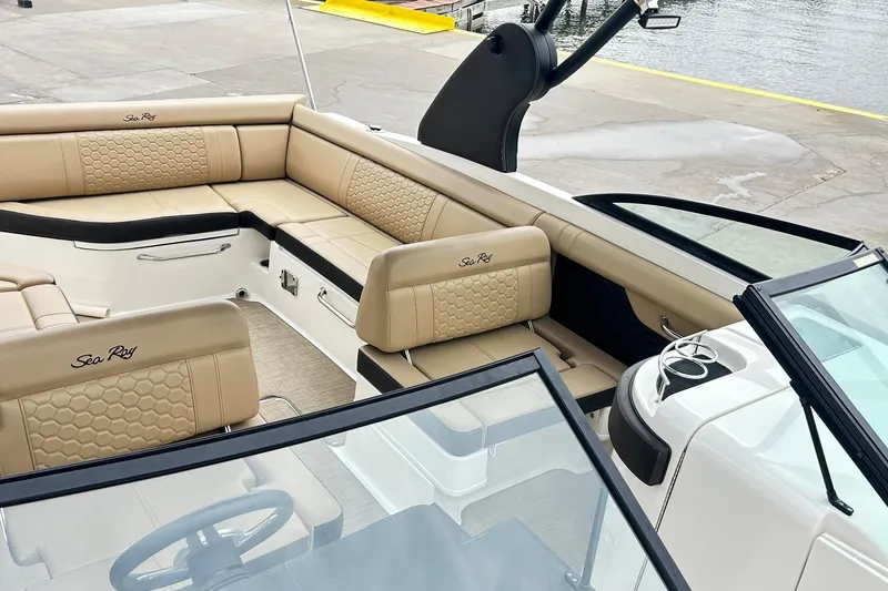 Slide: The Image of 2018 Sea Ray SDX 270 boat interior with beige seating and elegant design. - 6