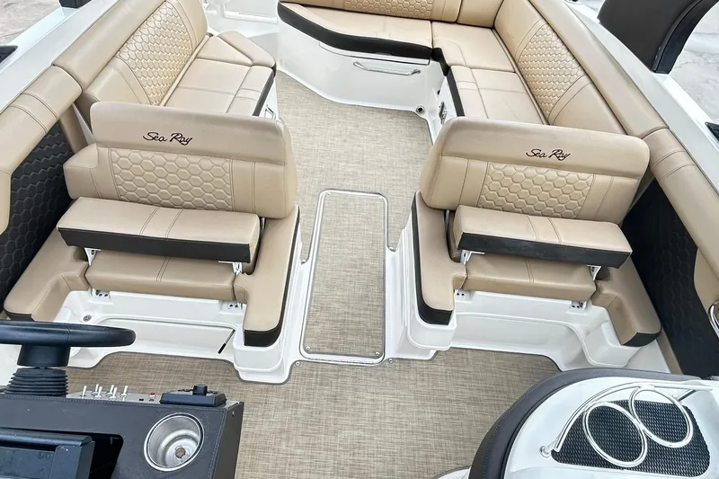Slide: The Image of 2018 Sea Ray SDX 270 boat interior with beige seating and modern design. - 9