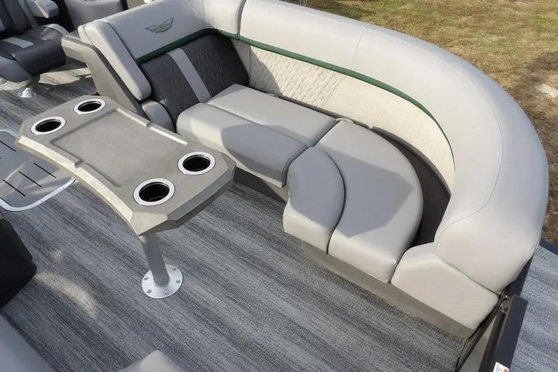 Slide: The Image of 2026 Bennington M Quad Bench 22 MFB with gray seating and cup holders on a boat. - 13