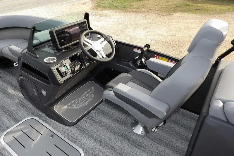 Slide: The Image of 2026 Bennington M Quad Bench 22 MFB boat interior with modern helm and seating. - 19