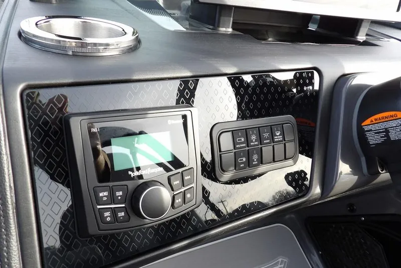 Slide: The Image of Dashboard of 2026 Bennington M Quad Bench 22 MFB with control panel and stereo system. - 20