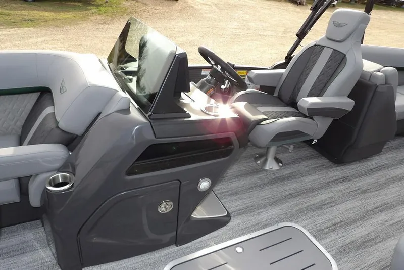 Slide: The Image of 2026 Bennington M Quad Bench 22 MFB boat interior with modern helm and seating. - 22