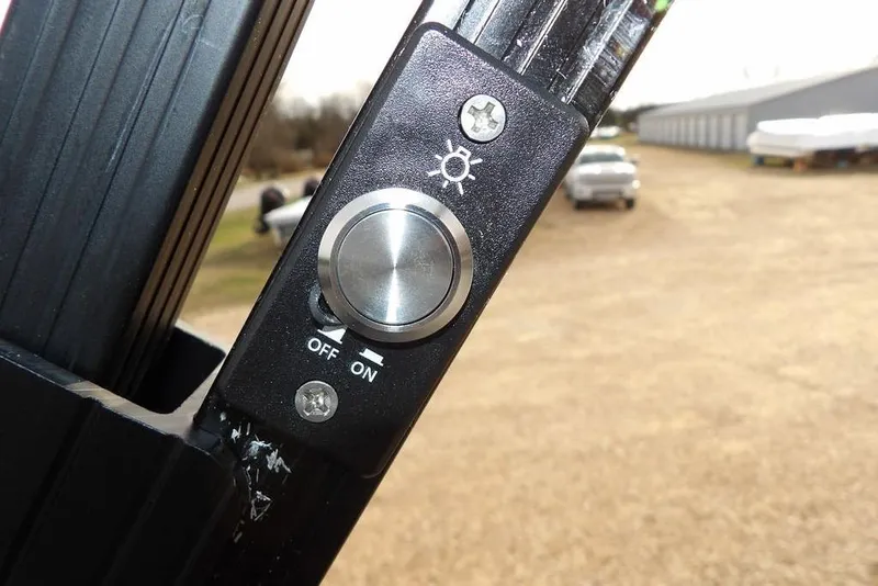 Slide: The Image of Close-up of Bennington M Quad Bench 22 MFB 2026 light switch, showing on/off positions. - 35