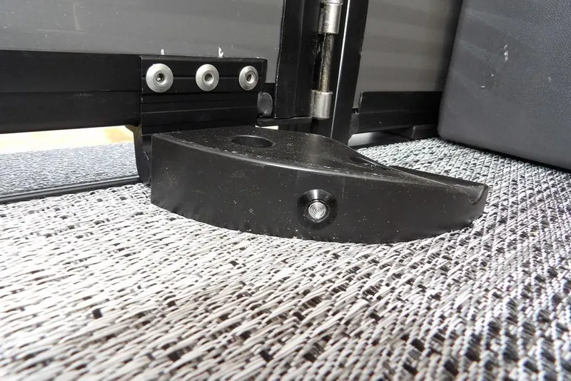 Slide: The Image of Close-up of Bennington M Quad Bench 22 MFB 2026 hinge detail on textured surface. - 36