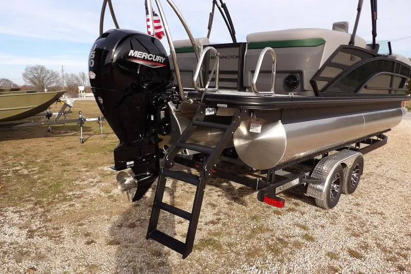 Slide: The Image of 2026 Bennington M Quad Bench 22 MFB pontoon boat with Mercury outboard engine. - 39