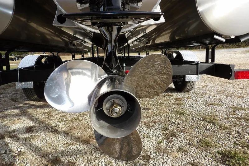Slide: The Image of Propeller of 2026 Bennington M Quad Bench 22 MFB pontoon boat on trailer. - 40