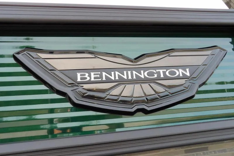 Slide: The Image of Bennington logo on 2026 M Quad Bench 22 MFB boat, featuring sleek design. - 41